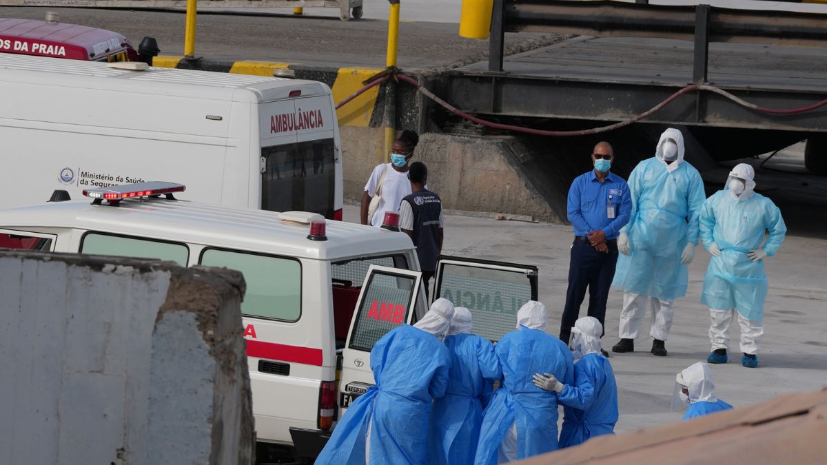 Health workers in protective gear evacuate patients from the MV Hondius cruise ship into an ambulance at a port in Praia, Cape Verde | AP