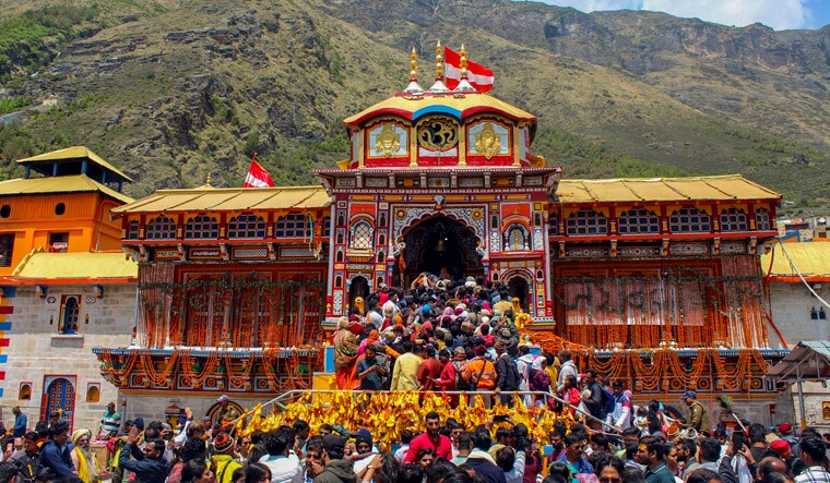 Chamoli: Devotees arrive to offer prayers at Badrinath Temple during the 'Char Dham Yatra', in Chamoli district, Thursday, May 23, 2024. (PTI Photo)(PTI05_23_2024_000172B)