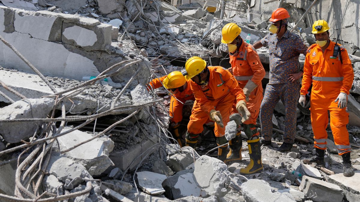 Rescue workers remove the debris to look for the trapped survivors of an under-construction building that collapsed on Tuesday, following heavy rains in Bengaluru on October 23, 2024 | PTI
