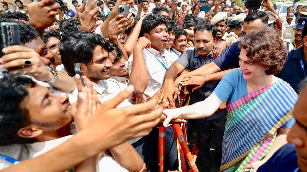 Congress leader Priyanka Gandhi Vadra greets the students of Nilgiri College of Arts and Science, in Thaloor | PTI