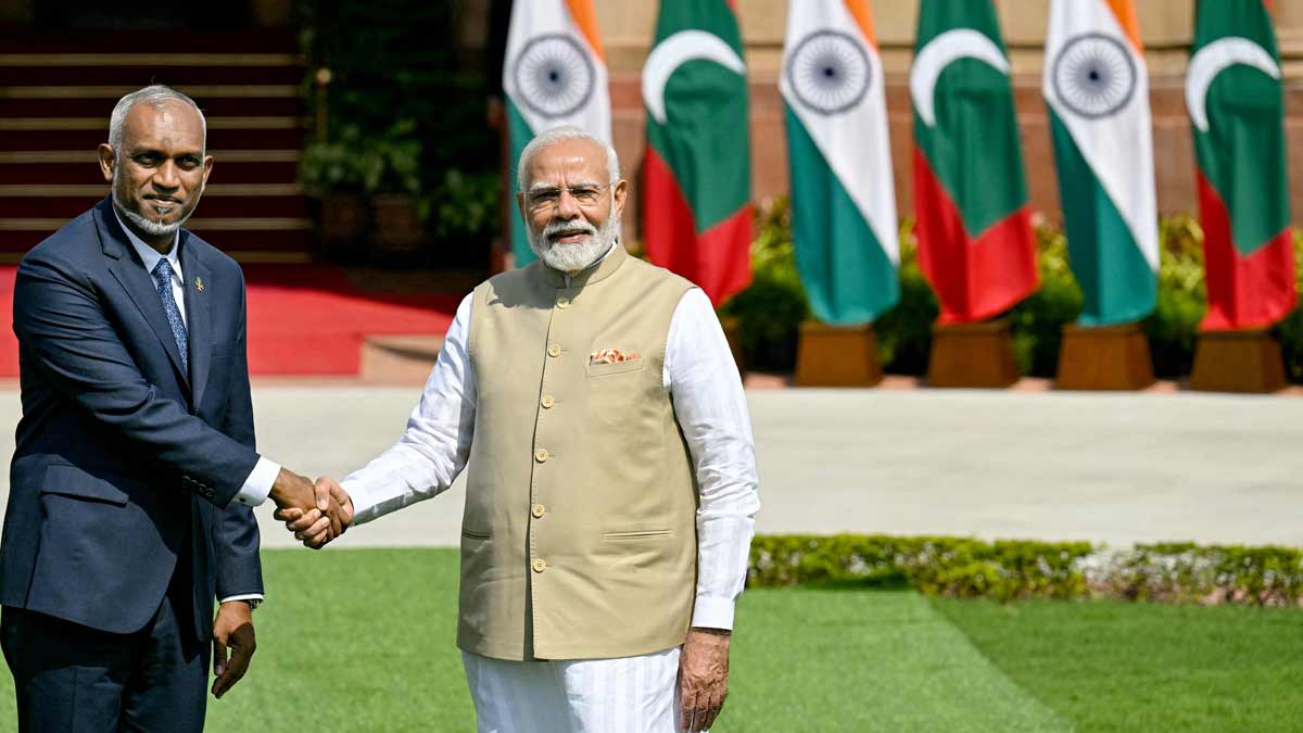 Prime Minister Narendra Modi (R) and Maldives President Mohamed Muizzu shake hands before their meeting at the Hyderabad House in New Delhi  | AFP