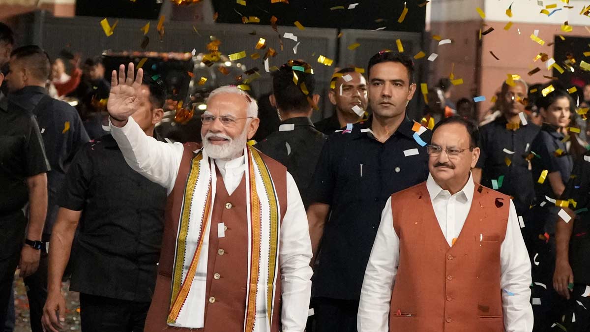 Prime Minister Narendra Modi greets the gathering upon his arrival at the party headquarters | PTI