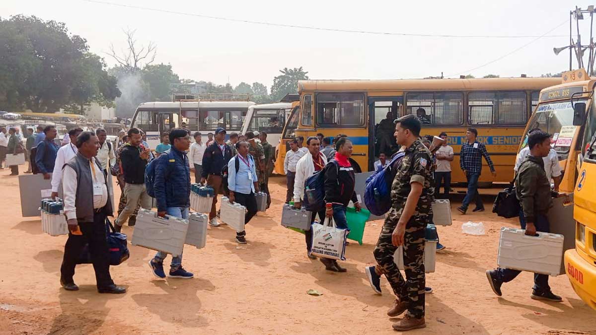 Polling officials carrying EVMs leave for their respective polling stations ahead of voting in the first phase of Jharkhand Assembly elections | PTI