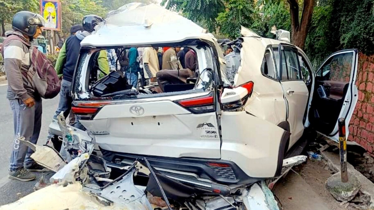 The wreckage of the vehicle after a car collided with a container truck, at ONGC Chowk in Dehradun | PTI