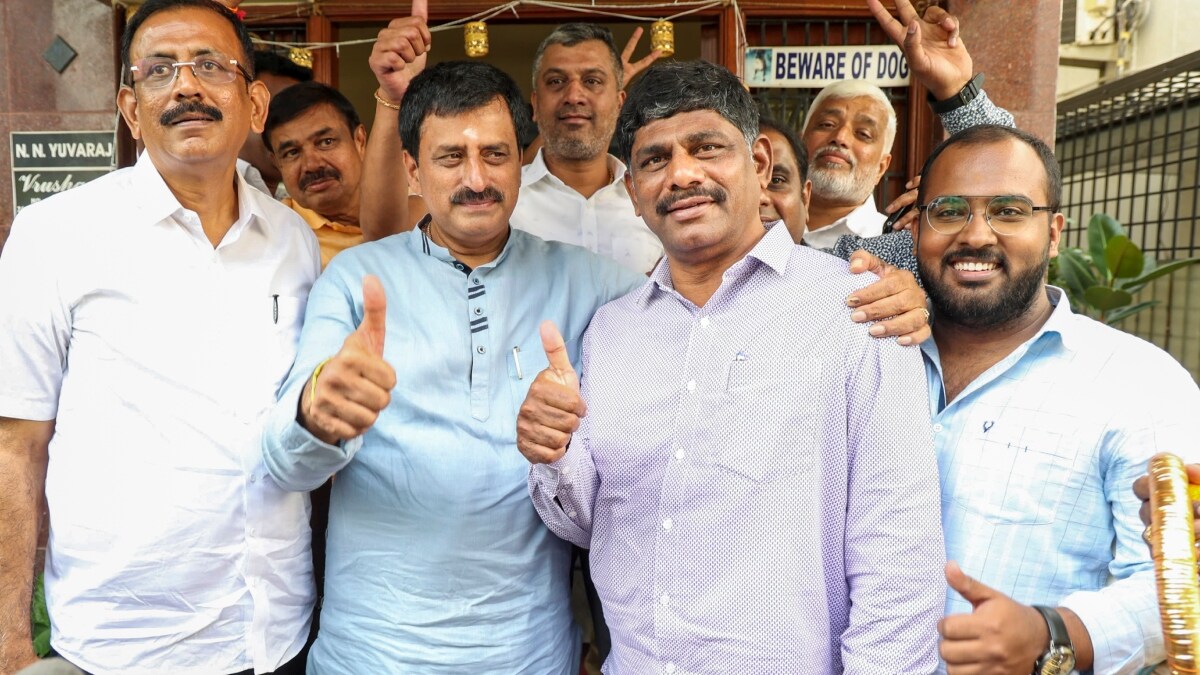 Congress candidate CP Yogeshwar with party leader DK Suresh after winning Karnataka's Channapatna Assembly constituency bypoll | PTI