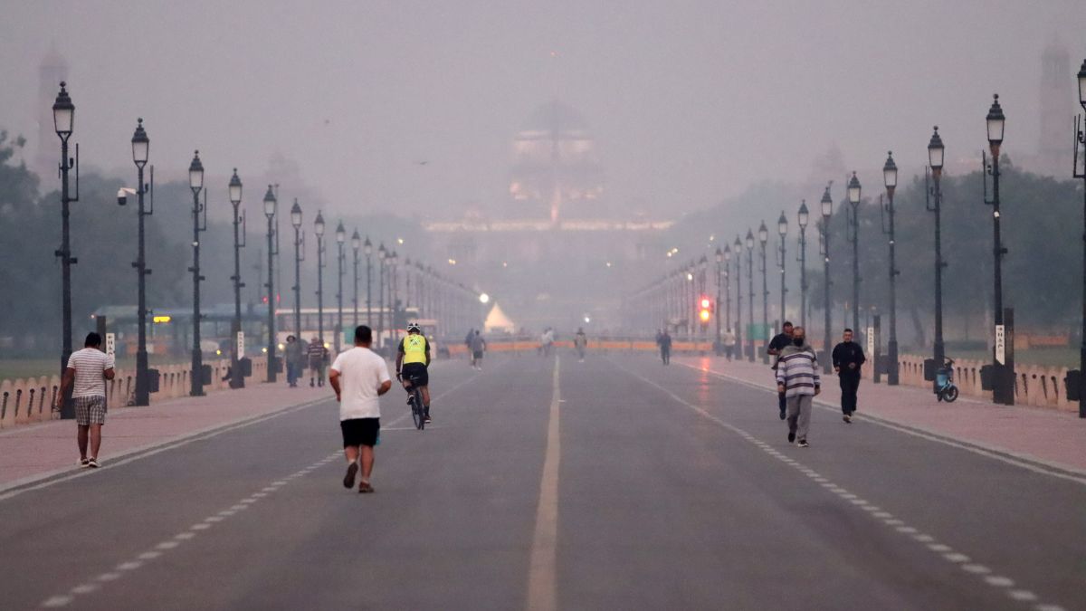 People jog at Kartavya Path as air quality continues to remain poor, in New Delhi | PTI (File)
