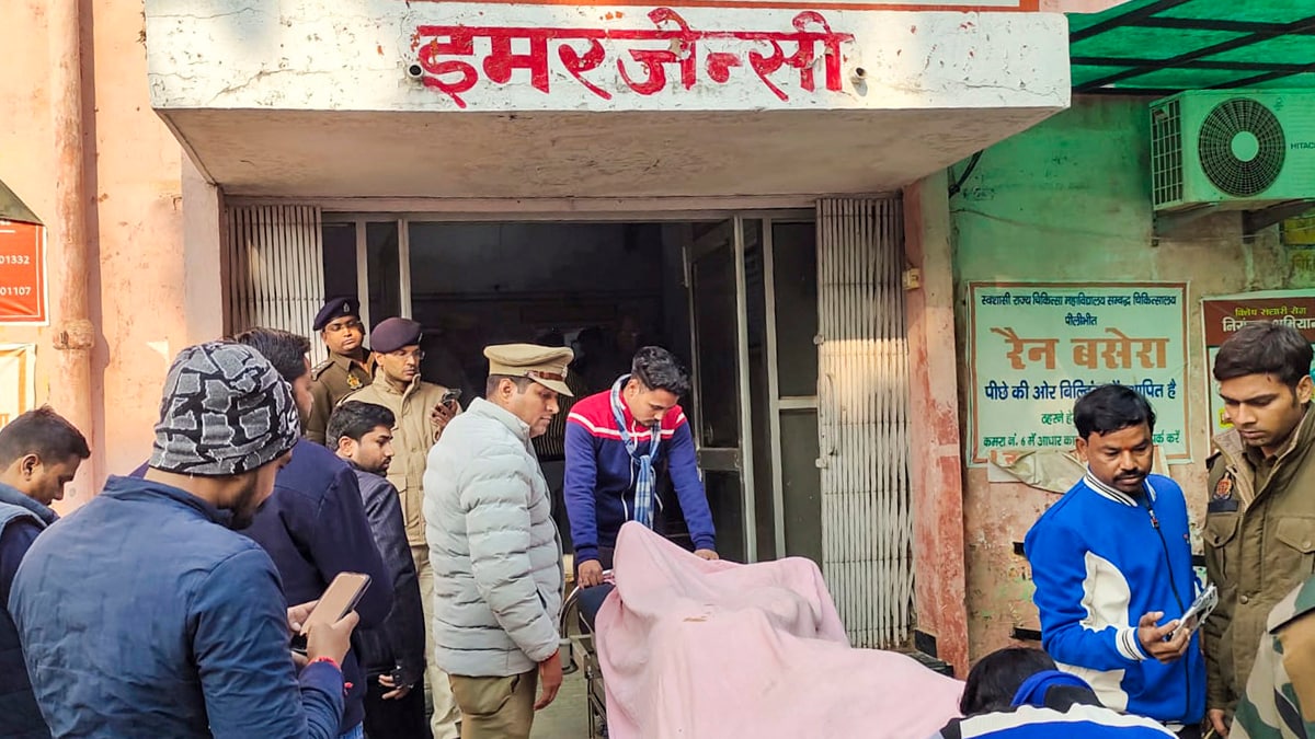 Pilibhit: Police personnel and others stand near the body of one of the three terror suspects who, allegedly involved in the grenade attack in Gurdaspur, were killed in an encounter with a joint team of Uttar Pradesh and Punjab police, at a hospital, in Pilibhit, Monday, Dec. 23, 2024. (PTI Photo) (PTI12_23_2024_000022A)