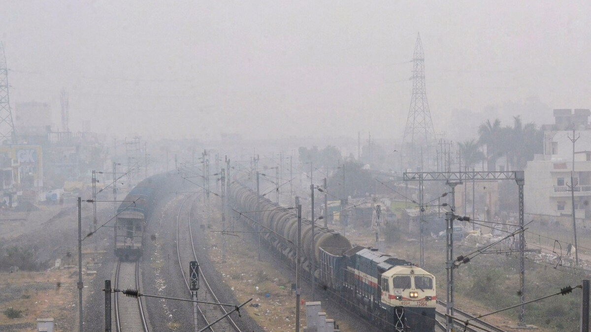 Trains pass through dense fog on a cold winter morning in Bhopal | PTI 