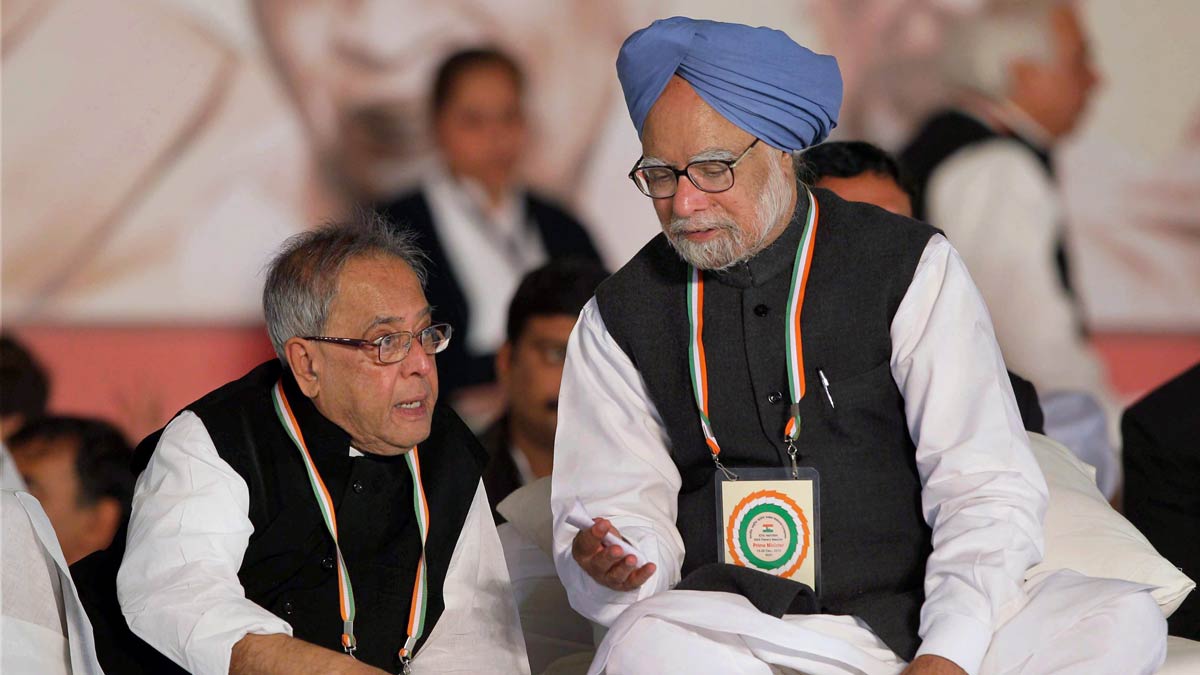In this Dec. 20, 2010 file image, Prime Minister Manmohan Singh speaks to Finance Minister Pranab Mukherjee | PTI