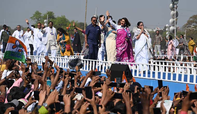Chief Minister Mamata Banerjee, along with the TMC candidates, walks the ramp greeting supporters at the Brigade Parade Ground in Kolkata | Salil Bera