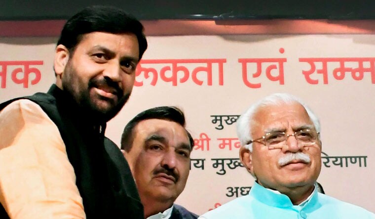 (File) Nayab Singh Saini (extreme left) and Manohar Lal Khattar (right) at an event in Karnal | PTI