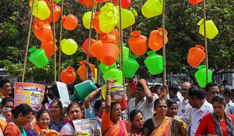 Women protest against the Karnataka government over ongoing water crisis at Freedom Park in Bengaluru | PTI