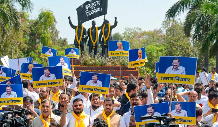 AAP workers and supporters at Shaheedi Park during a protest over the arrest of Delhi Chief Minister Arvind Kejriwal in connection with an excise policy-linked money-laundering case, in New Delhi | PTI