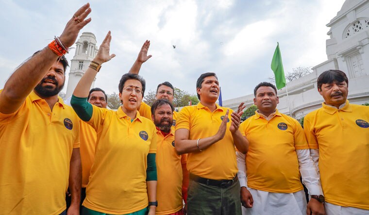 Delhi Ministers Atishi and Saurabh Bharadwaj with AAP MLAs protest at the Delhi Legislative Assembly against the arrest of Chief Minister Arvind Kejriwal | PTI