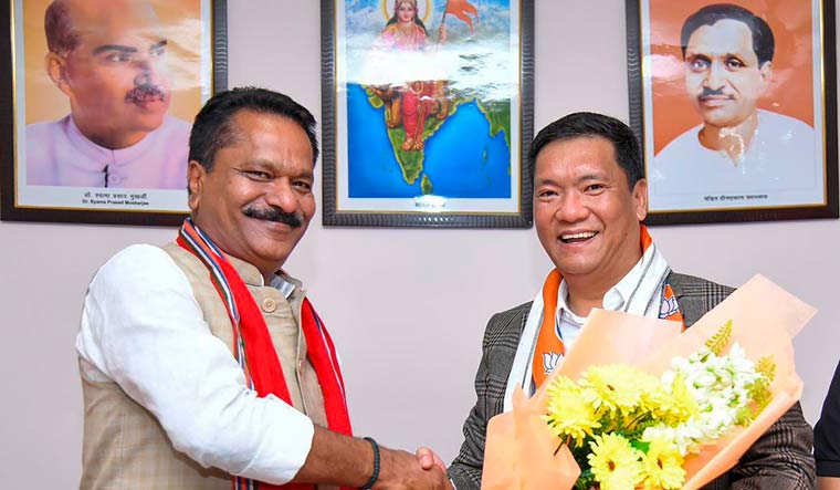 Arunchal Pradesh Chief Minister Pema Khandu being congratulated by BJP leader Ashok Singhal after he was elected unopposed in the state assembly polls | PTI