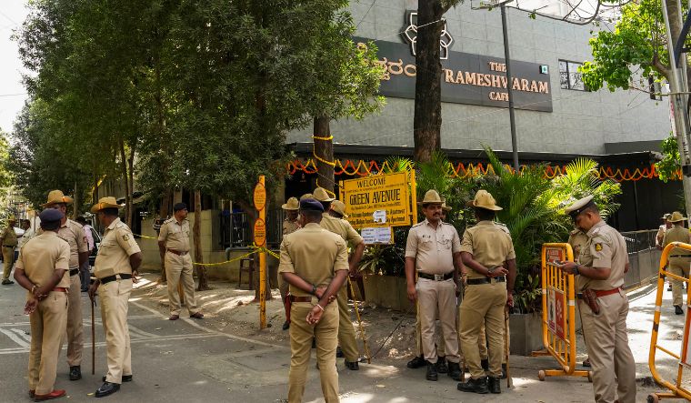 Security personnel stand guard at the Rameshwaram cafe blast site, in Bengaluru | PTI
