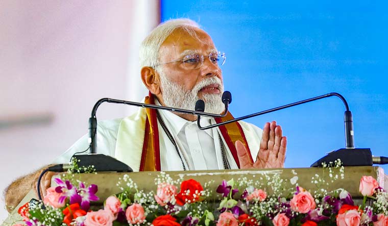 Prime Minister Narendra Modi addresses during the launch of development initiatives, in Adilabad, Telangana | PTI