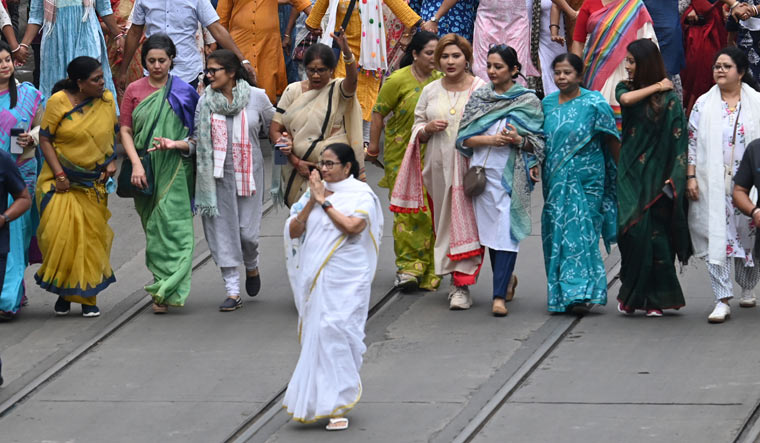 West Bengal Chief Minister and Trinamool Congress supremo Mamata Banerjee leads in a rally on the eve of International Women's Day, in Kolkata | Salil Bera