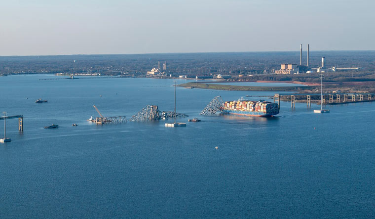 Cargo ship M/V Dali is shown with the collapsed Francis Scott Key Bridge | AP