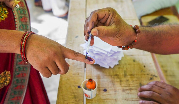 Aurangabad: An election official marks a voter's finger with the indelible ink during the first phase of voting for Lok Sabha elections, in Aurangabad, Friday, April 19, 2024. (PTI Photo)(PTI04_19_2024_000182B)
