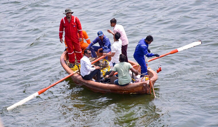 **EDS: CORRECTS DETAILS** Surat: A team of police officials led by senior police officer Daya Nayak, known as ’encounter specialist’ (not in frame), during search for a revolver thrown by Bishnoi brothers in the River Tapi after they allegedly opened fire at actor Salman Khan's residence, in Surat, Monday, April 22, 2024. (PTI Photo) (PTI04_22_2024_RPT106B)