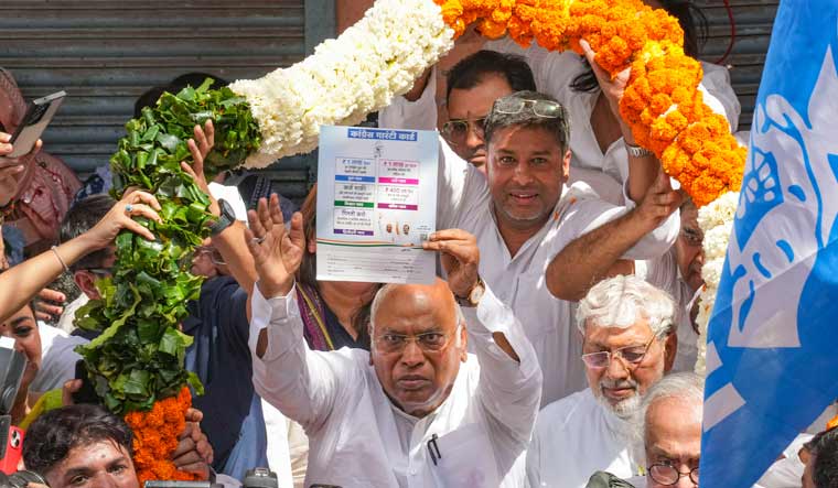 Congress president Mallikarjun Kharge with party leaders and supporters during the launch of the party's ‘Ghar Ghar Guarantee Abhiyan’ ahead of Lok Sabha elections, in New Delhi | PTI