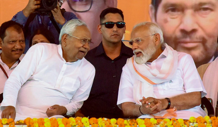 Prime Minister Narendra Modi with Bihar Chief Minister Nitish Kumar during a public meeting in Jamui | PTI