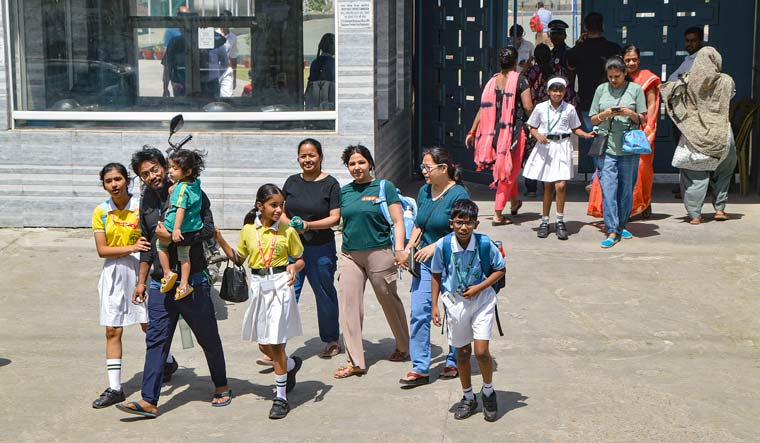 Students come out of the DPS School, Siddharth Vihar after a bomb threat | PTI