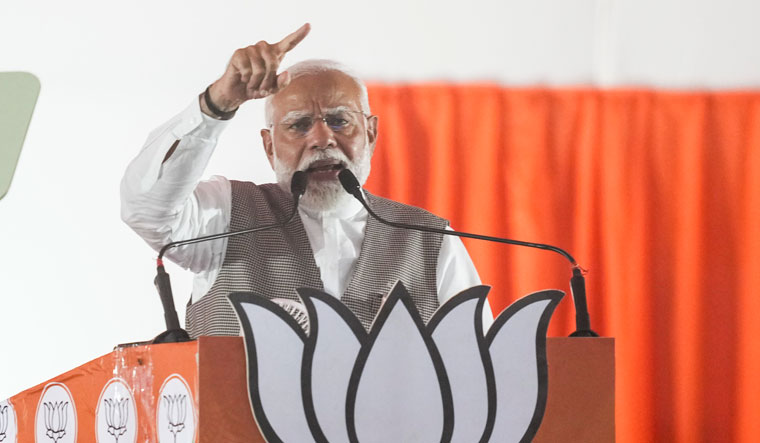 Prime Minister Narendra Modi addresses a rally for Lok Sabha elections, at Kartar Nagar in Delhi | PTI