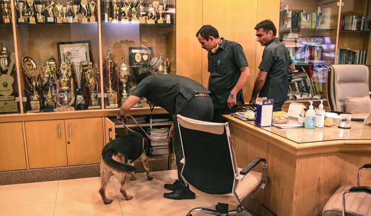 Security personnel inspect an office at the DPS School after a bomb threat was received by the school via e-mail, at Sector 30, in Noida | PTI