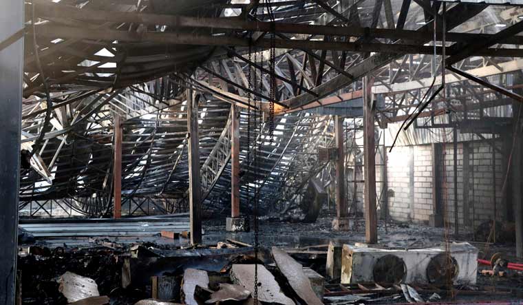 Mangled and burnt ceiling of a fun park is seen after a fire in Rajkot in the Indian state of Gujarat | AP