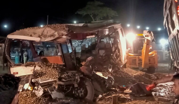 Shahjahanpur: A damaged bus after a dumper truck overturned on it, in Shahjahanpur, Saturday night, May 25, 2024. At least 11 people were killed and 10 others suffered injuries, according to police. (PTI Photo)(PTI05_26_2024_000025A)