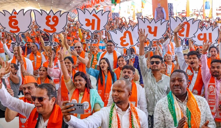 Supporters cheer during a public meeting addressed by Prime Minister Narendra Modi ahead of the third phase of Lok Sabha elections in Gujarat | PTI