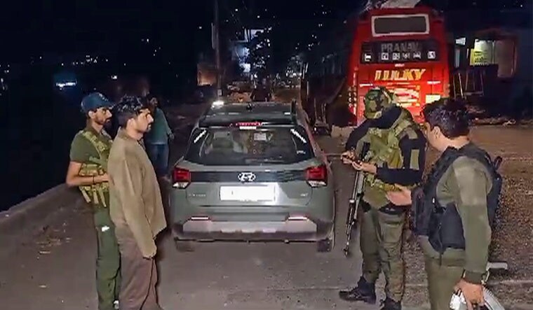 Security personnel stand guard after a militant attack on army vehicles, in Poonch district | PTI