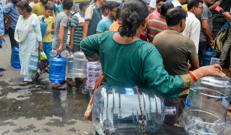 Residents queue up to purchase drinking water amid water crisis, in Siliguri | PTI