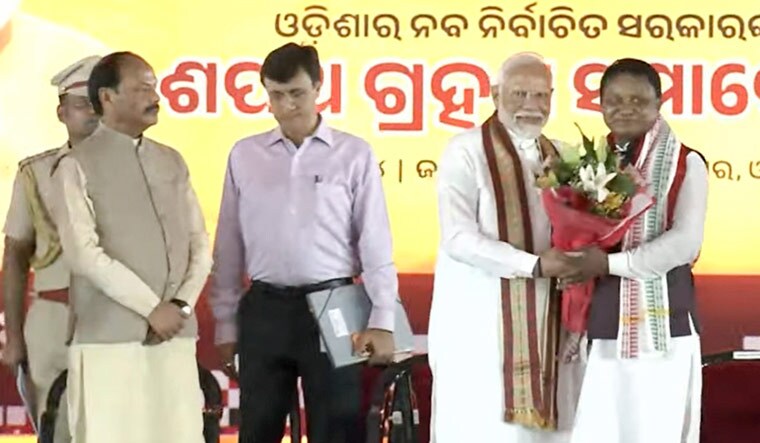 Prime Minister Narendra Modi with Odisha's Chief Minister-designate Mohan Charan Majhi during the latter's swearing-in ceremony, in Bhubaneswar | PTI