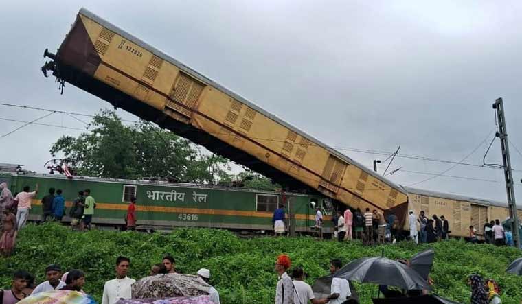 The wagon of the goods train suspended in air after it rammed into the Kanchenjunga Express at Silguri in West Bengal | X
