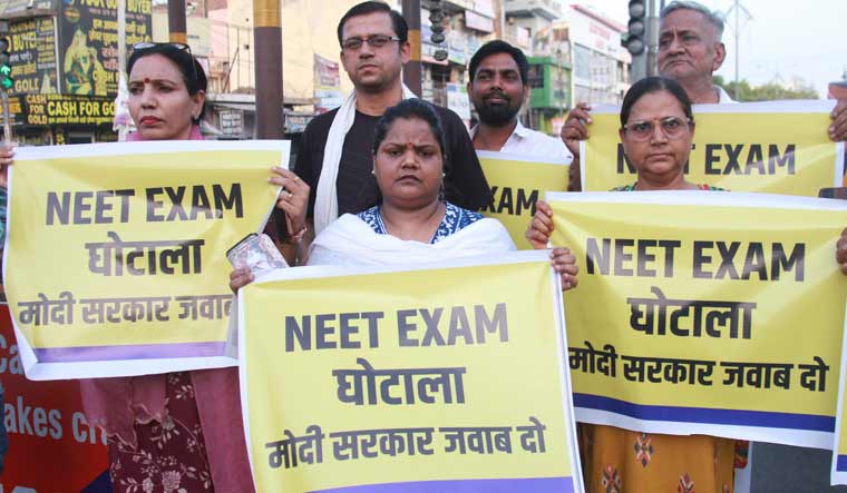 Aam Aadmi Party (AAP) workers hold protest against NEET Exam irregularities, in Gurugram | PTI