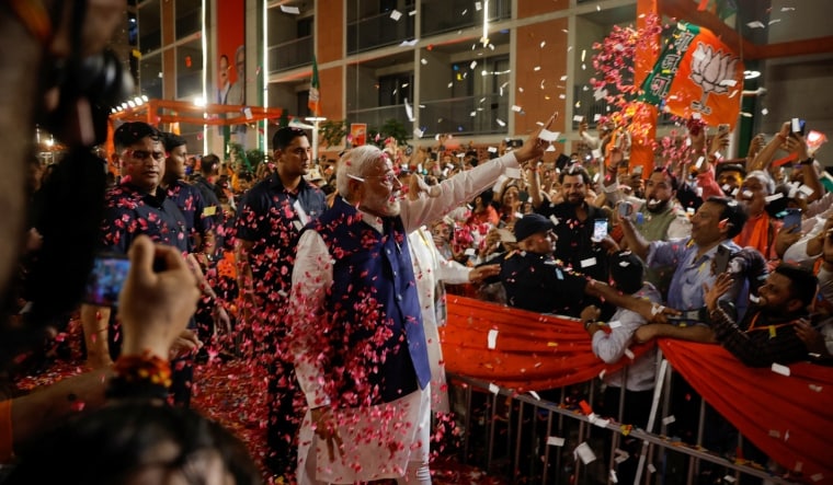 Prime Minister Narendra Modi gestures as he arrives at Bharatiya Janata Party (BJP) headquarters in New Delhi | Reuters