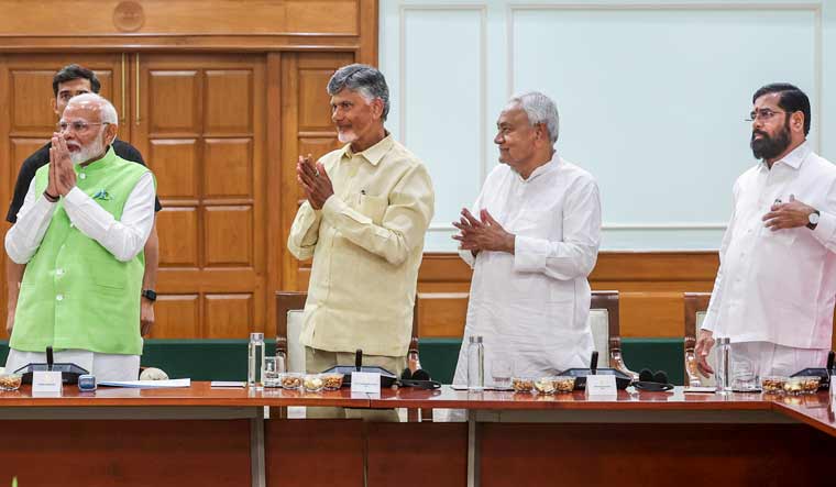 Prime Minister Narendra Modi with TDP chief N Chandrababu Naidu, JD(U) chief Nitish Kumar and Shiv Sena chief Eknath Shinde during a meeting of the NDA at PM's residence | PTI