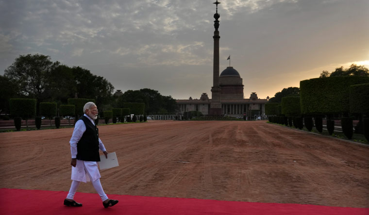 Narendra Modi walks to address media after receiving a letter from President Draupadi Murmu, inviting him to form the next government | AP