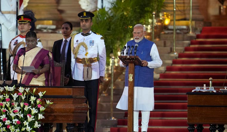 Narendra Modi is sworn-in as the Prime Minister by President Draupadi Murmu, left, at the Rashtrapati Bhawan | AP