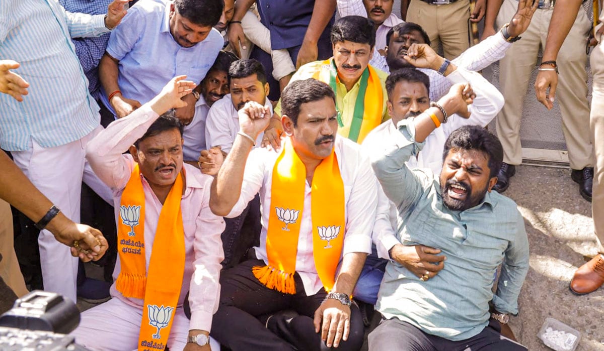 Mysuru: Karnataka BJP President B Y Vijayendra along with other party leaders stages a protest against alleged fraudulent allotment of sites to land losers by Mysuru Urban Development Authority, which involves plots given to Karnataka Chief Minister Siddaramaiah's wife, in Mysuru, Friday, July 12, 2024. (PTI Photo)(PTI07_12_2024_000160B)