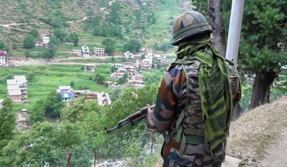 A security official stands guard amid heavy security near the site of a recent encounter with terrorists at Desa village, in Doda district, Jammu and Kashmir on July 17, 2024 | PTI