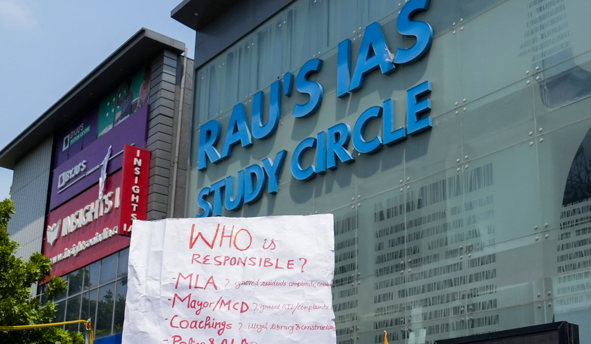 A placard held by a student during a protest after three civil services aspirants died due to drowning at a coaching centre in Delhi | PTI