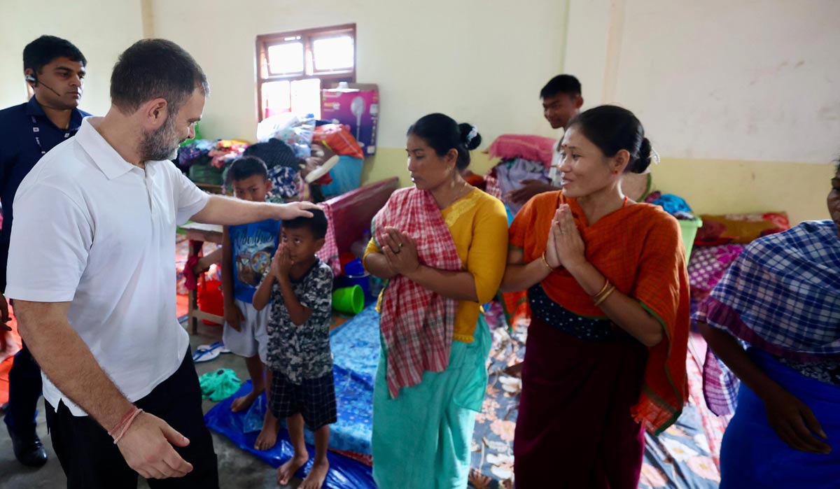 Raul Gandhi interacts with victims of violence at a relief camp set up in Jiribam Higher Secondary School | X/INC