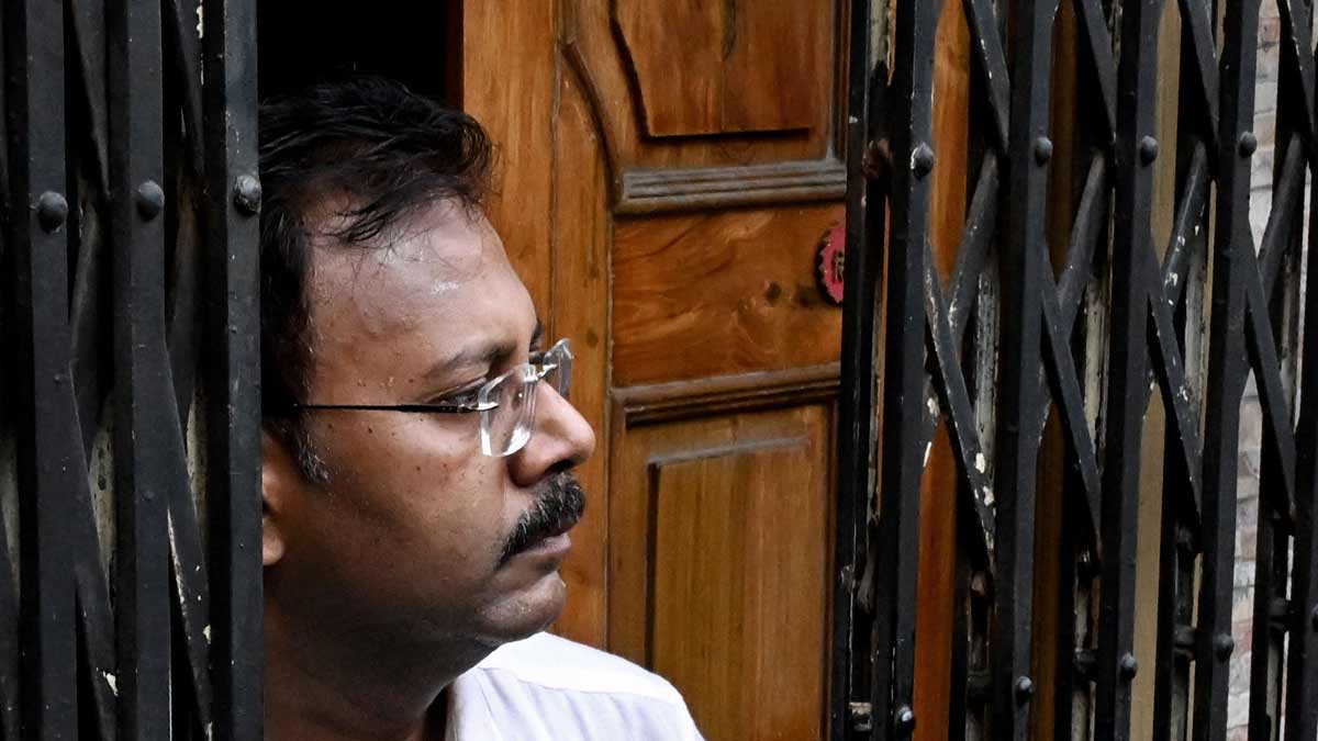 R.G. Kar Medical College and Hospital former principal Sandip Ghosh, looks on as CBI personnel raid his residence | AFP