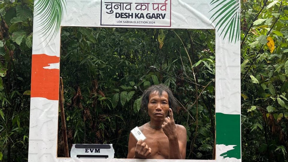A Shompen tribe flaunts his inked finger after exercising his voting right for the first time in the history of Great Nicobar, in Andaman and Nicobar Islands. | PTI