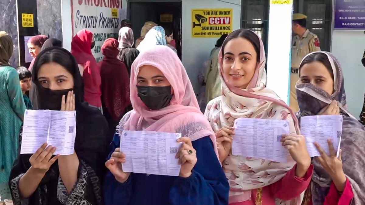 Women voters show their voting slips at a women-only polling station in Kishtwar district | PTI
