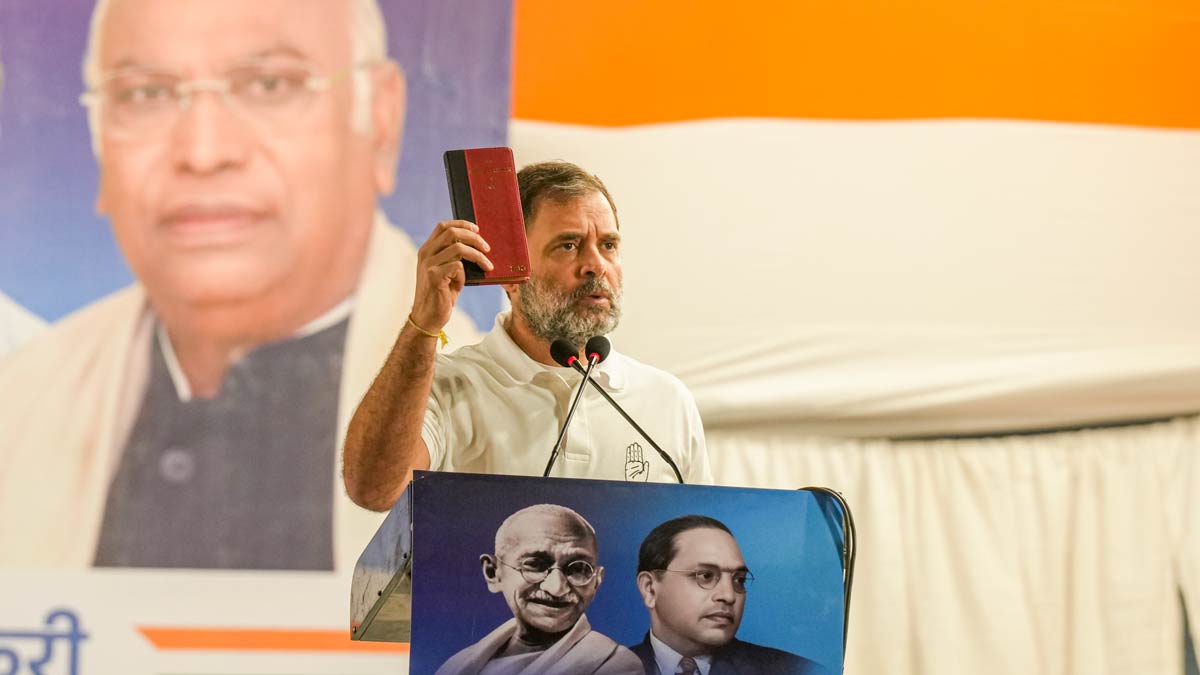 Congress leader Rahul Gandhi shows a copy of the Constitution during the 'Jai Bapu, Jai Bhim, Jai Samvidhan' public meeting at Seelampur in Delhi | PTI